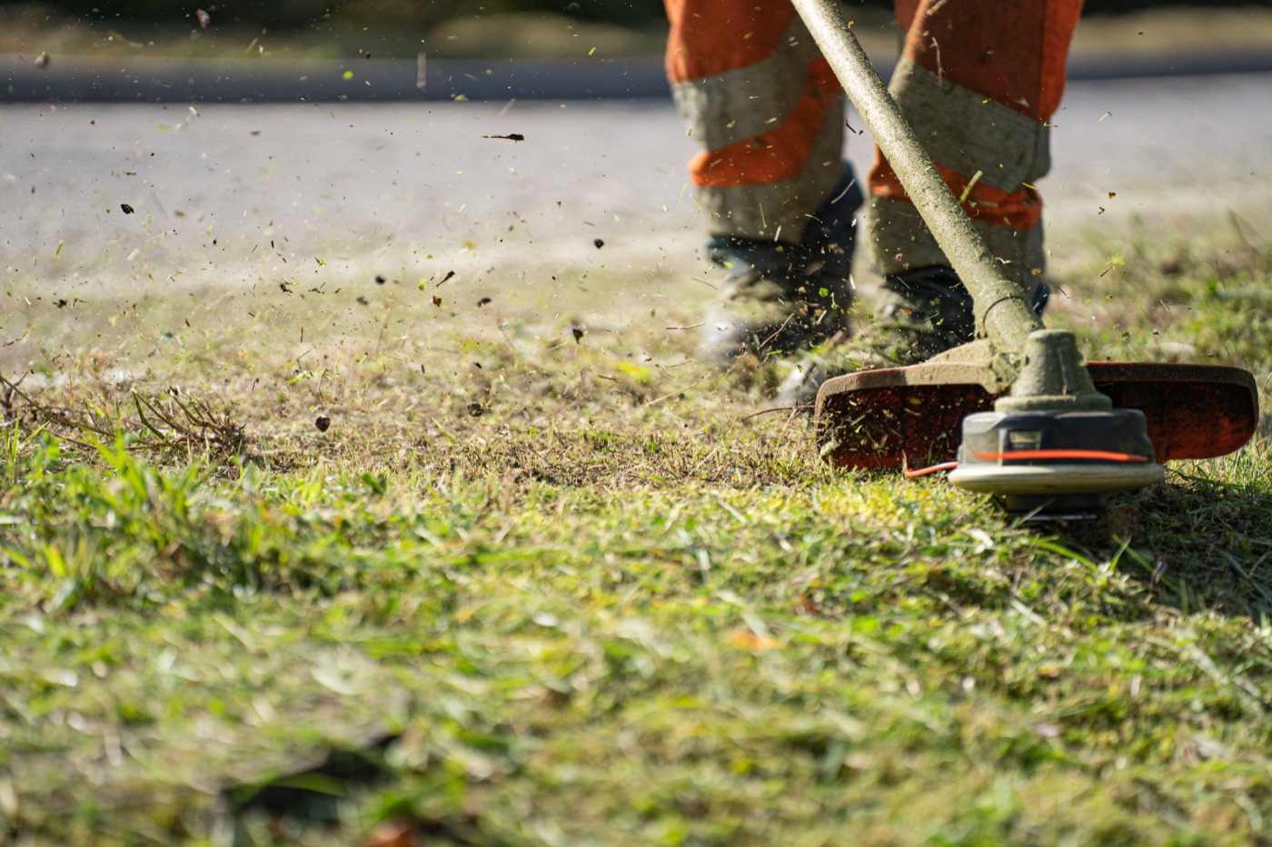 Close-up of grass trimming work